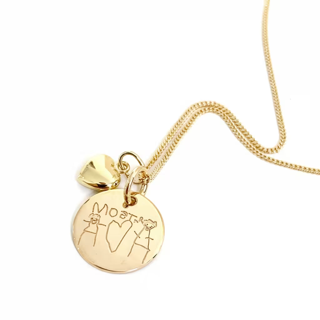 barnets teckning eller handavtryck på ett halsbandshänge i äkta guld 18k. Eget avtryck som minne